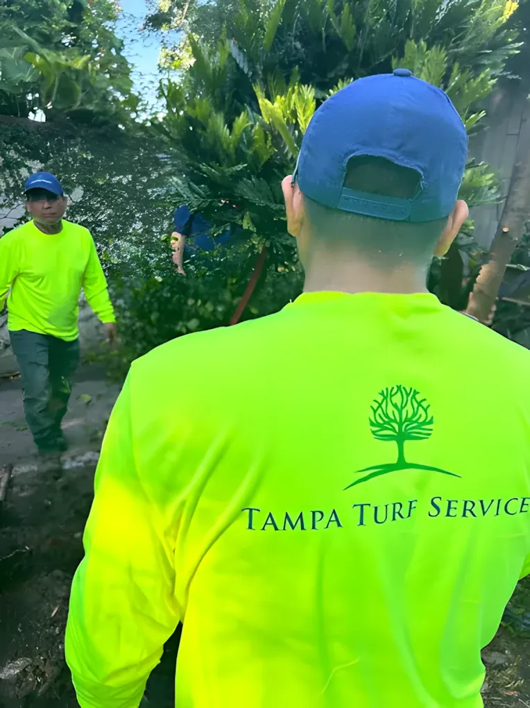 Tampa Turf Services crew in uniform at a commercial property