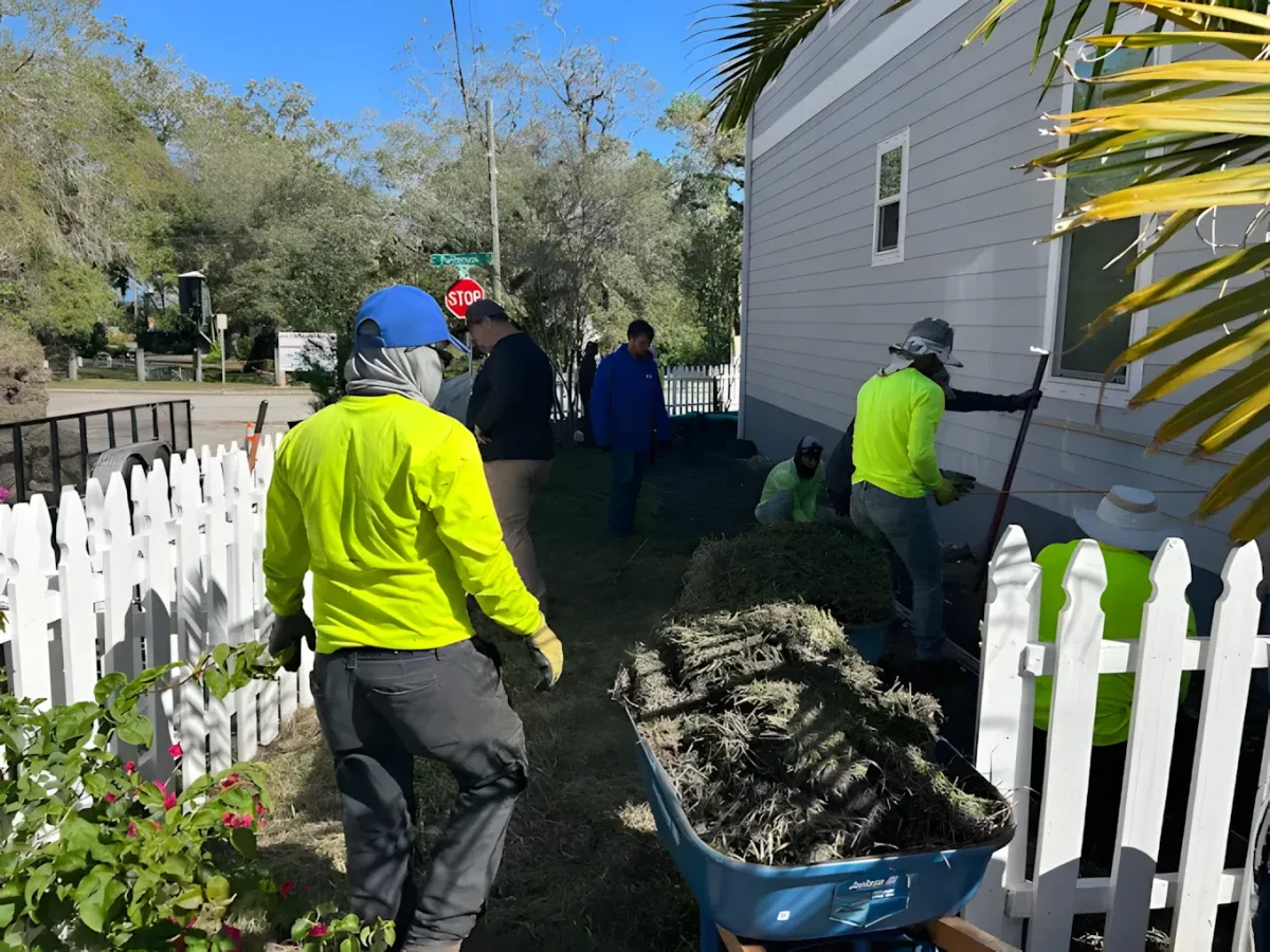Tampa Turf Services crew working on a property cleanup