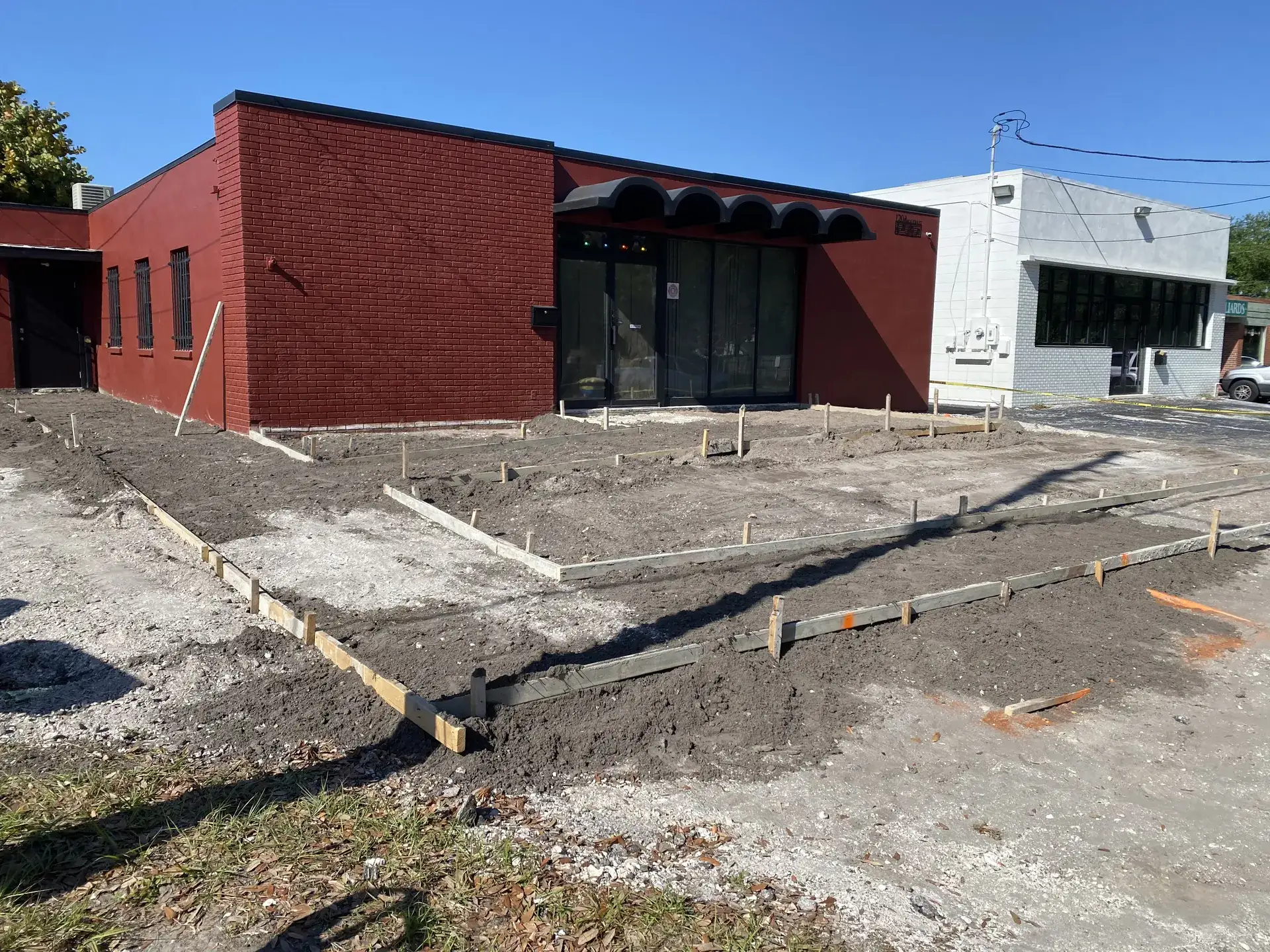 Beds laid out and graded before planting at a Tampa commercial property